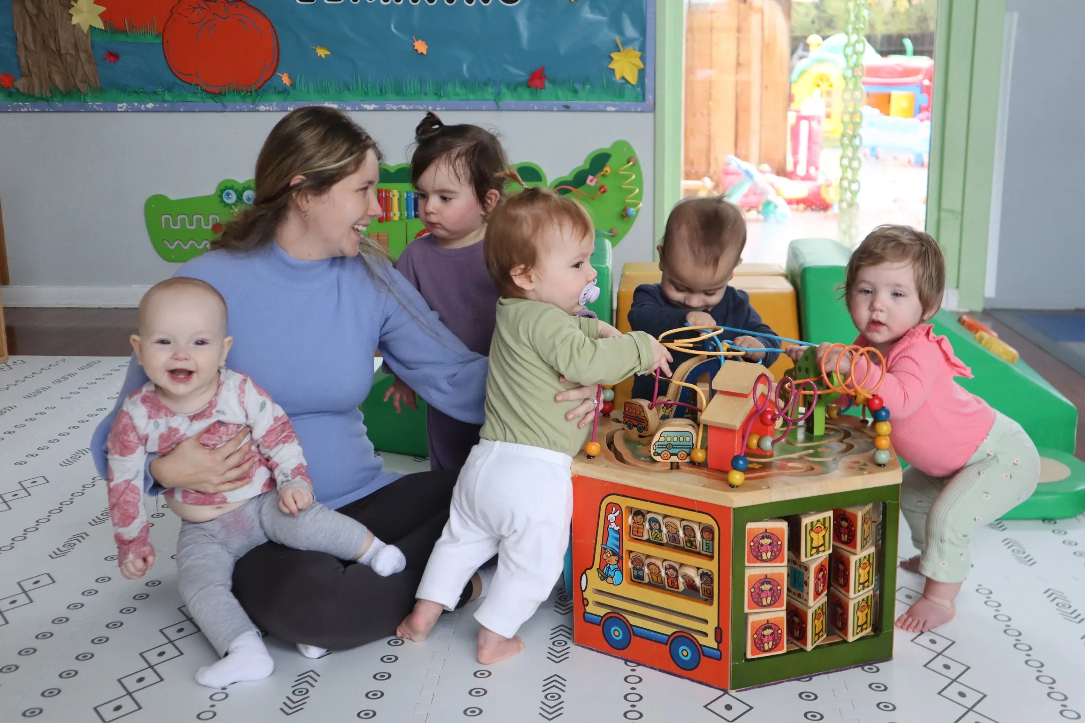 Preschool students collaborating during interactive STEM and circle time activities in Pleasanton